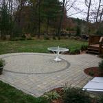 Radial paver patio with planting beds