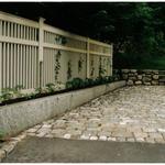 Granite  retaining wall with antique cobblestone (Belgian Block) 