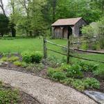 Peastone path wanders past rustic paddock and barn area