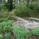 Quiet sitting area offers a resting space along the peastone walk