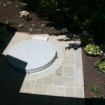 Built-in Hot Tub with custom radial cut bluestone ring and multiple pattern bluestone pad