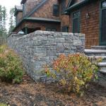 Van Tassel Granite retaining wall and steps with lilac colored bluestone treads