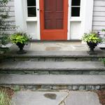 Lilac colored Bluestone rock-faced treads with Connecticut White Line risers and broken bluestone inset landing and walk
