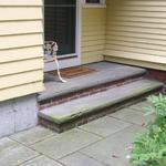 Bluestone landing and step with clay brick riser and multiple pattern bluestone walk